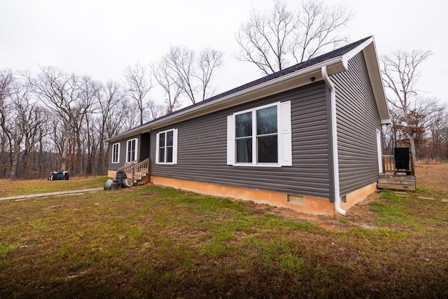 view of home's exterior featuring a yard