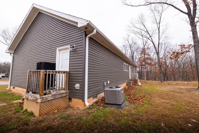 view of side of property with central AC unit