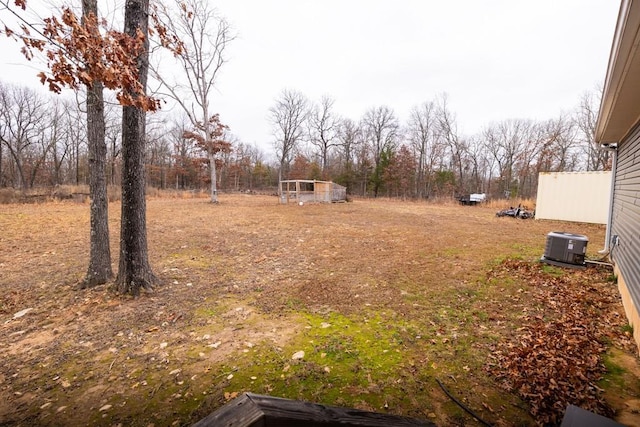 view of yard with central AC unit