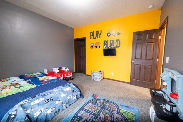 carpeted bedroom featuring a textured ceiling