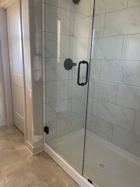 bathroom featuring a stall shower