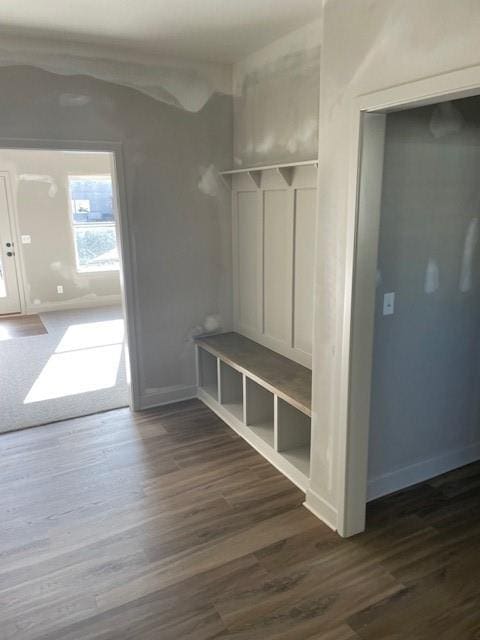 mudroom with baseboards and dark wood-style floors