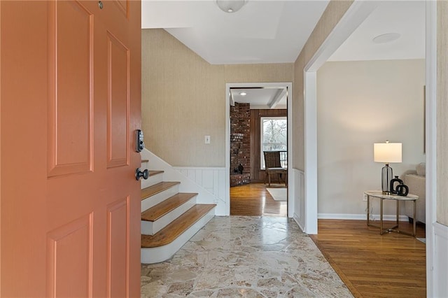 entryway with hardwood / wood-style flooring