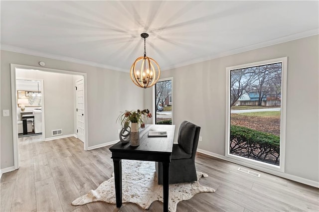 office area featuring an inviting chandelier, ornamental molding, and light wood-type flooring