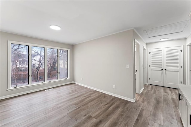 spare room featuring light hardwood / wood-style flooring