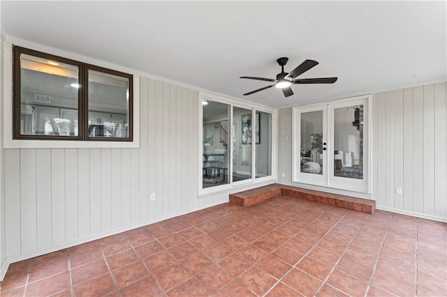 interior space featuring ceiling fan and french doors