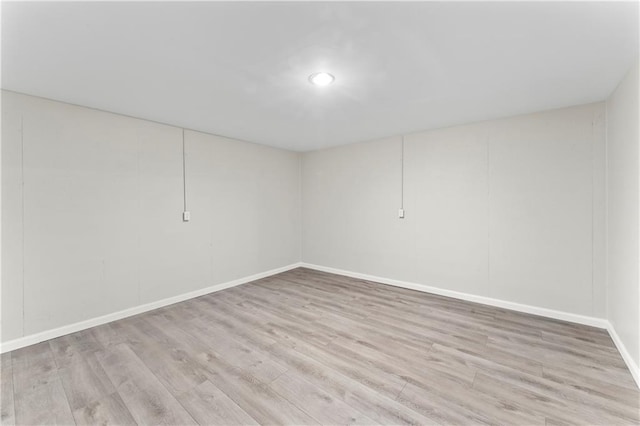 unfurnished room with light hardwood / wood-style floors