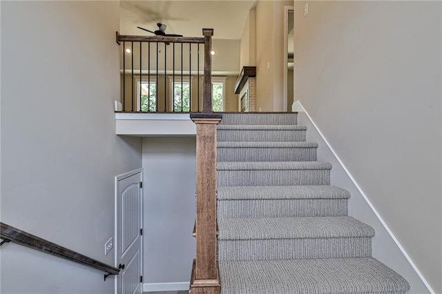 stairs with ceiling fan