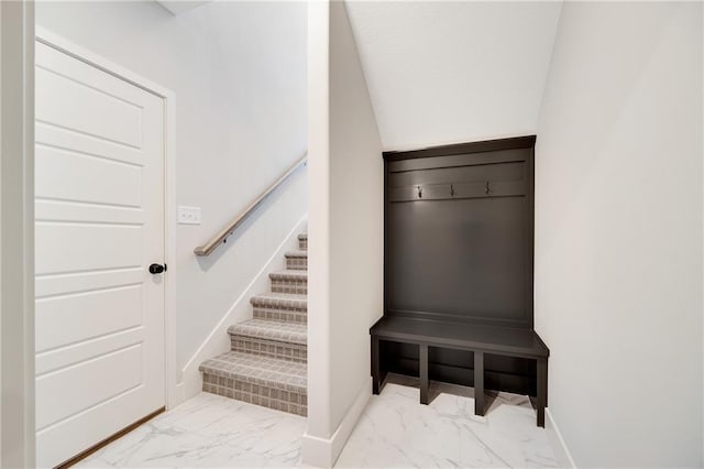 interior space with marble finish floor and baseboards