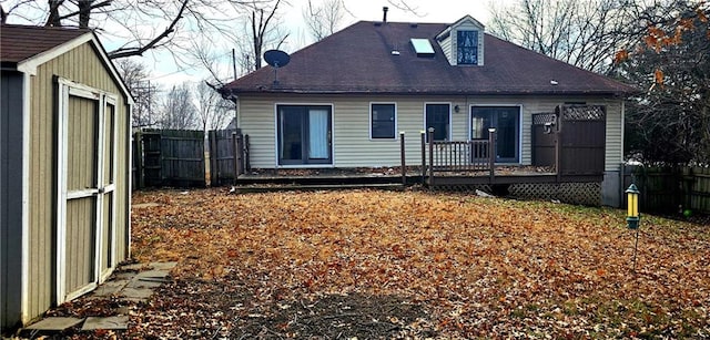 back of property with a storage unit