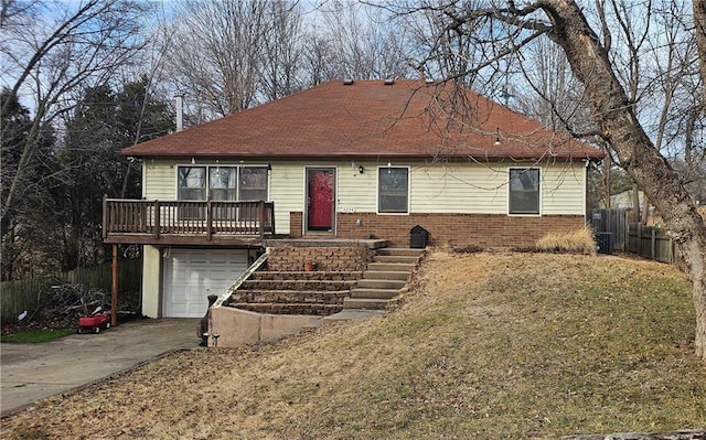 view of front of house with a garage and a front yard