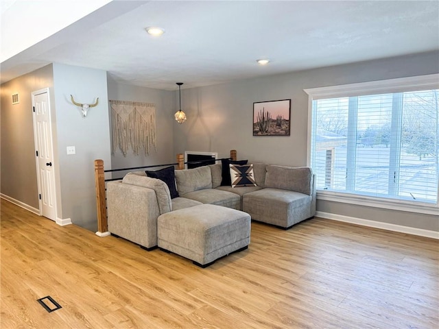 living room with light hardwood / wood-style floors