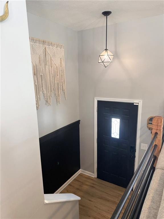 entryway with hardwood / wood-style flooring