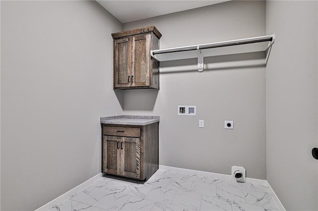 washroom with marble finish floor, electric dryer hookup, hookup for a washing machine, and baseboards