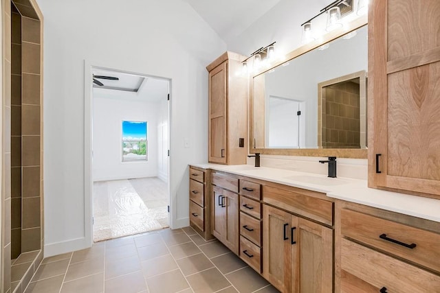 bathroom with ceiling fan, tile patterned flooring, and vanity