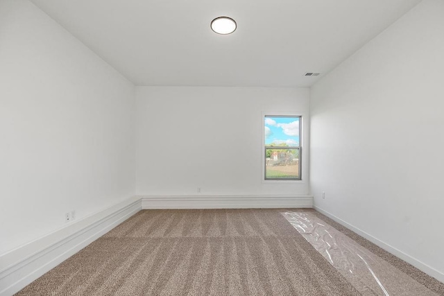 empty room with carpet flooring