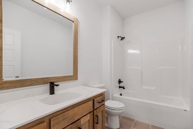 full bathroom with tile patterned floors, vanity, bathtub / shower combination, and toilet