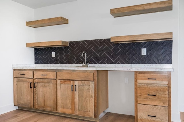 220 SW Chelmsford Dr, Blue Springs, MO 64015 - kitchen with tasteful backsplash, light countertops, a sink, and open shelves
