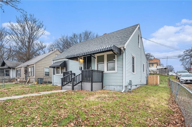 bungalow-style house with a front yard