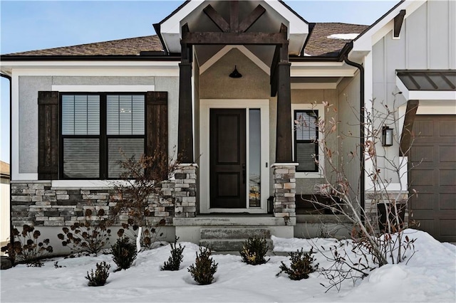 view of snow covered property entrance