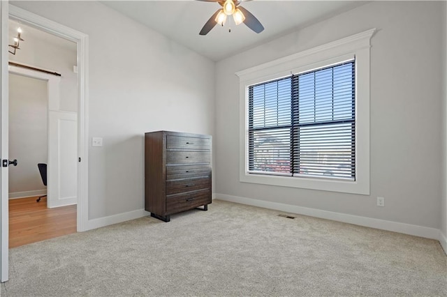 bedroom with light carpet and ceiling fan