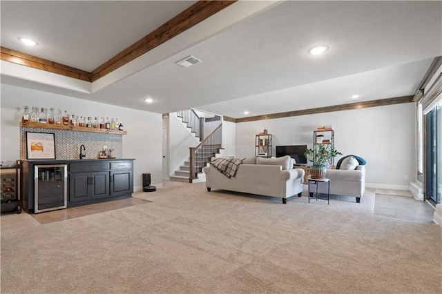 living room with light carpet, indoor wet bar, and wine cooler