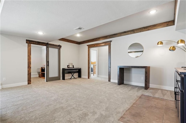 carpeted living room featuring a barn door