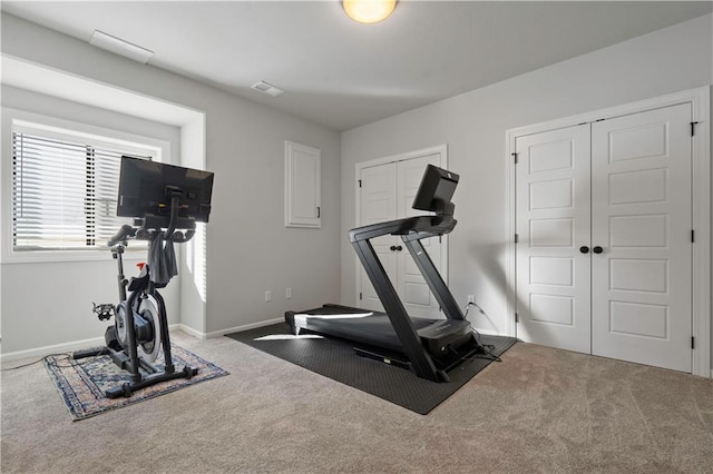 workout room featuring carpet