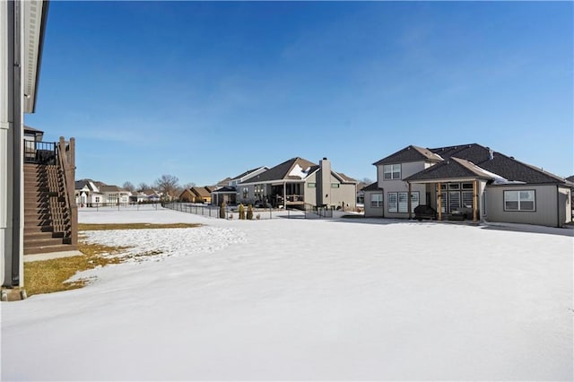 view of yard layered in snow