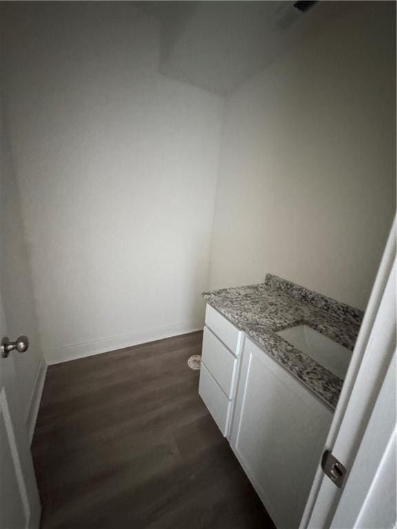 bathroom with wood-type flooring and vanity