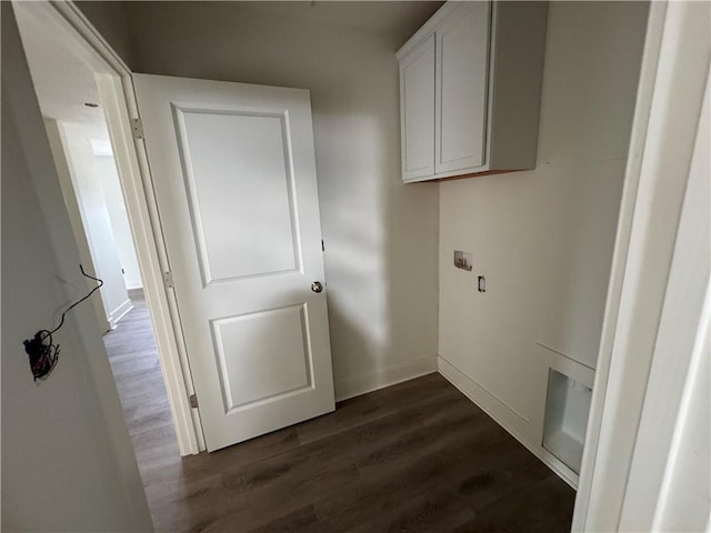 washroom featuring dark hardwood / wood-style flooring and cabinets