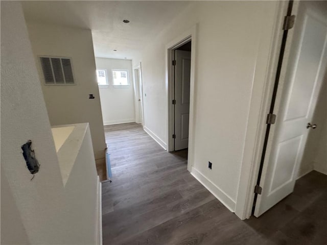 hall with dark wood-type flooring