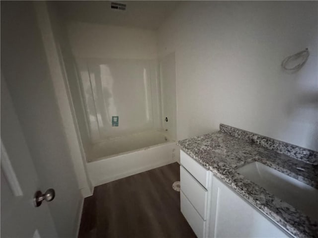 bathroom with vanity and hardwood / wood-style flooring