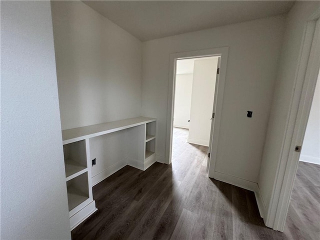 spare room with dark wood-type flooring