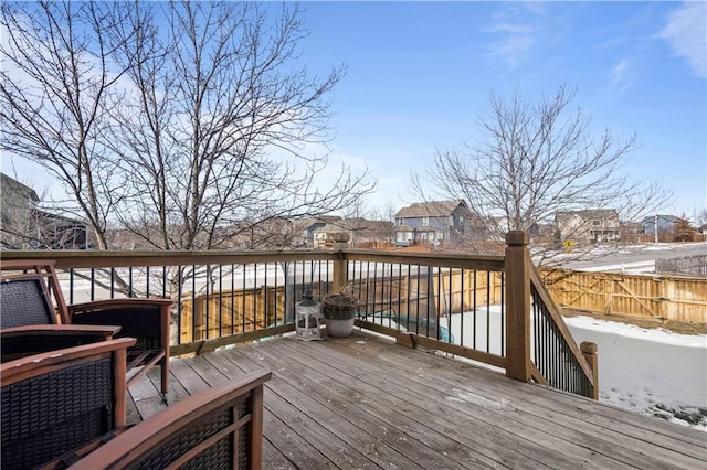 snow covered deck with a pool