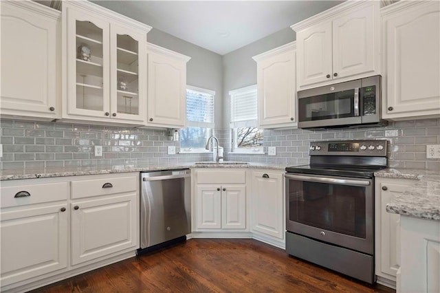 kitchen featuring white cabinetry, stainless steel appliances, and sink