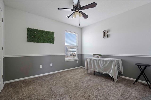 interior space with carpet and ceiling fan