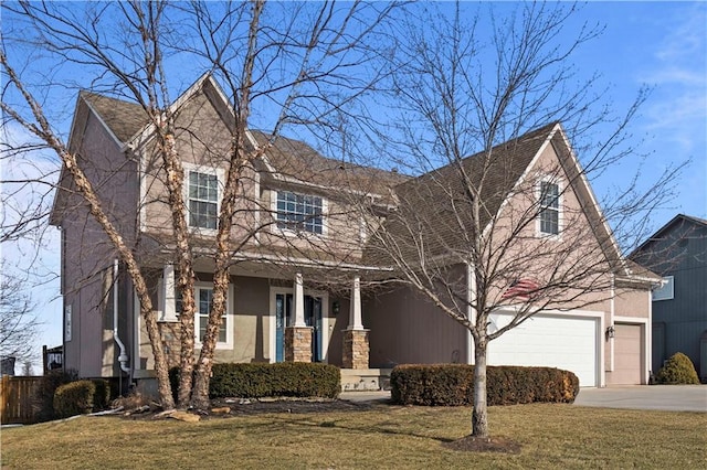 view of front of house featuring a garage and a front yard