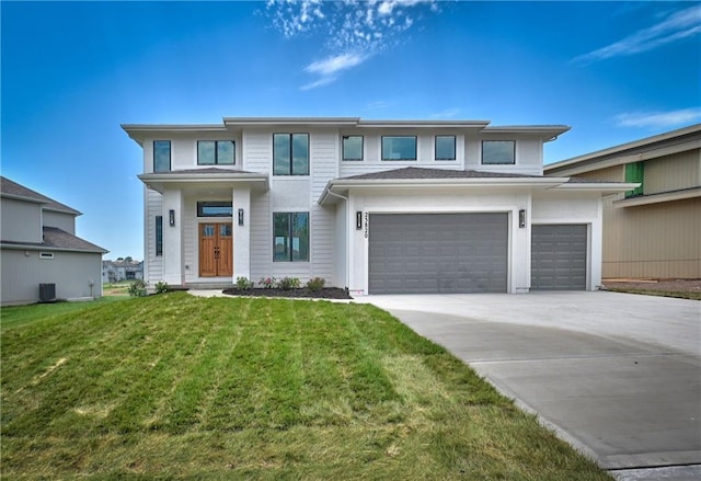 prairie-style house with central AC, a garage, and a front lawn