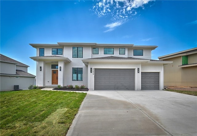 prairie-style house with a front yard and a garage