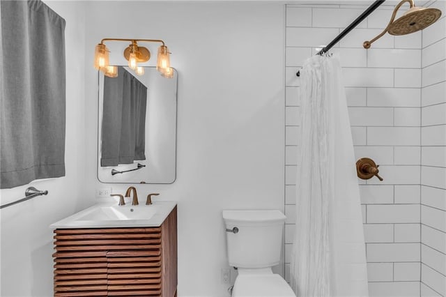 bathroom featuring walk in shower, vanity, and toilet