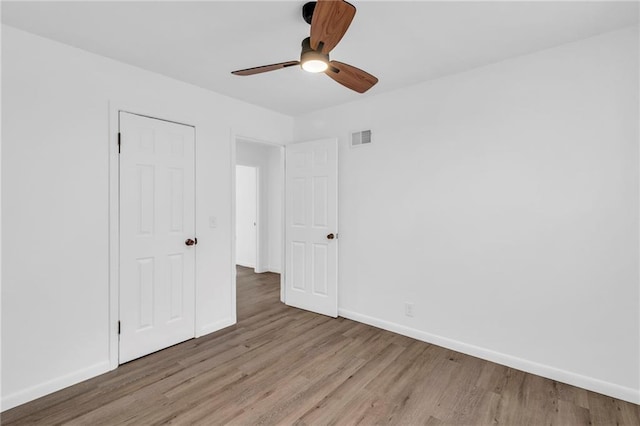 unfurnished bedroom featuring ceiling fan and light hardwood / wood-style floors