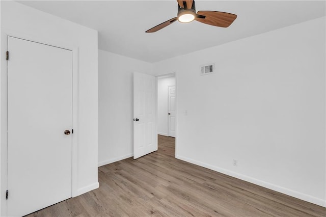 unfurnished bedroom featuring light hardwood / wood-style floors and ceiling fan