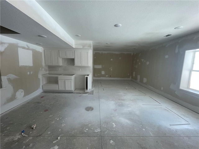 interior space featuring white cabinetry