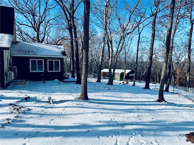 view of yard layered in snow