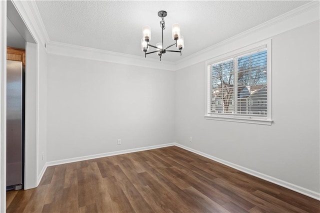 empty room with dark hardwood / wood-style flooring, crown molding, a chandelier, and a textured ceiling