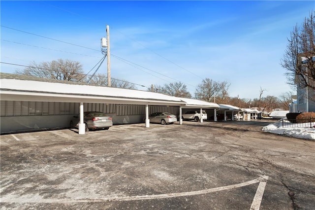 view of vehicle parking featuring a carport