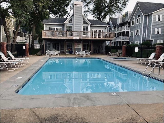 view of pool featuring a deck and a patio area