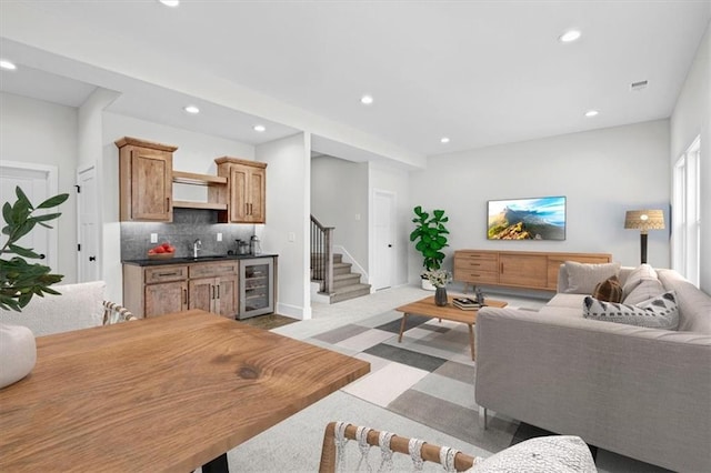 living room featuring wine cooler and wet bar