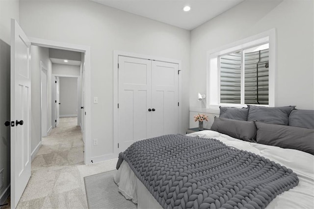 carpeted bedroom featuring a closet